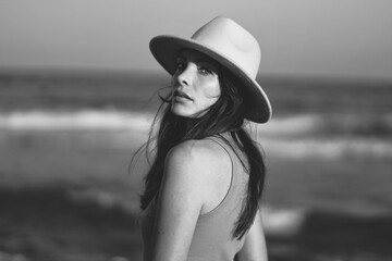 beautiful woman in hat on the beach in varna bulgaria, model shooting - obrazy, fototapety, plakaty