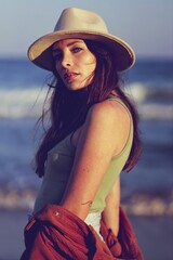 beautiful woman in hat on the beach in varna bulgaria, model shooting