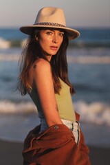 beautiful woman in hat on the beach in varna bulgaria, model shooting