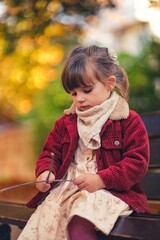 little beautfiul child playing on the playground in varna bulgaria , model shooting 