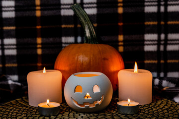 halloween pumpkins and lantern on blanket
