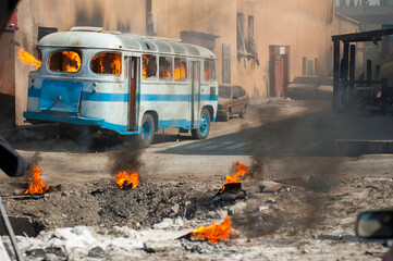 burning bus on the street after the explosion