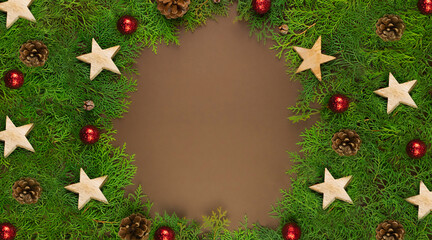 Fototapeta na wymiar Christmas card on brown background with Thuja branches, red balls, wooden stars and place for text.