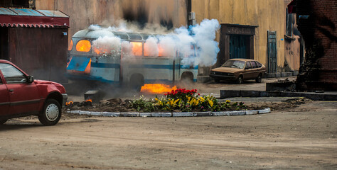 burning bus on the street after the explosion