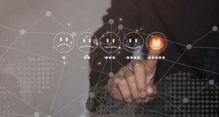 A Businessman is Touching Smiley Face Emoticon on Virtual Screen to Give Satisfaction.