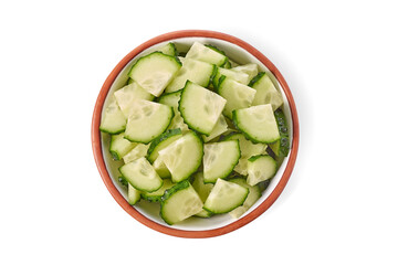Sliced fresh cucumber in ceramic bowl
