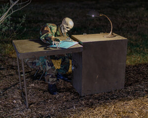 a skeleton dressed in uniform waits at a table at a haunted house during halloween
