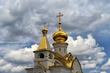 Fototapeta na wymiar Golden domes of orthodox church. Khabarovsk, St. Seraphim of Sarov Church. Far East, Russia.