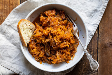 Traditional polish dish of bigos, cabbage with meat, mushrooms and prunes