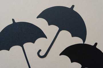 black paper umbrella glyph or dingbat cutouts