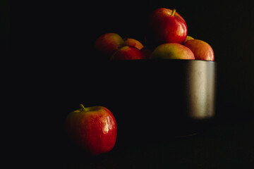 Red apples on black background