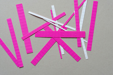 short pink paper stripes on gray