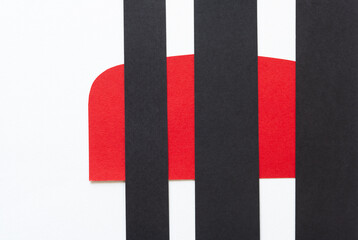 Fototapeta na wymiar graphic design background, featuring black paper stripes, and red rounded shape on white