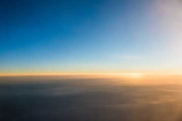 Fototapeta na wymiar Aerial shots taken from airplane window during sunset.