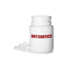 Plastic bottle with antibiotic pills on white background