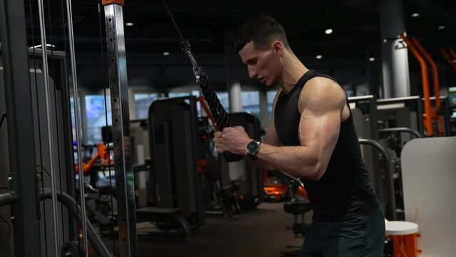 weight lifting. athletic sportsman training sport in gym with weight lifting machine.