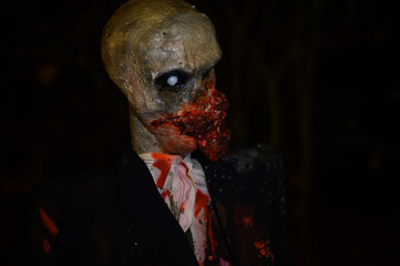 Horror zombie dummy as Halloween decoration in darkness - obrazy, fototapety, plakaty
