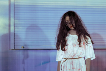 Portrait of a zombie girl in a halloween costume.