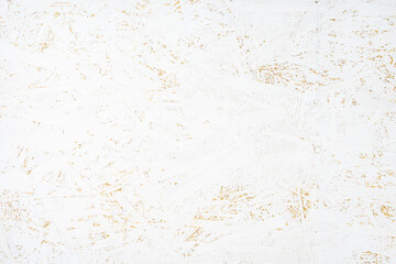 Oriented strand board OSB painted white. Background of rough surface made of compressed sawdust. Construction backdrop