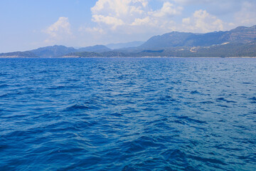 View of the rocky shore from the sea. Mediterranean Sea in Turkey. Popular tourist places. Background