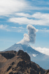 Crater fumarole among clouds of popocatepetl volcano in Mexico, panoramic view