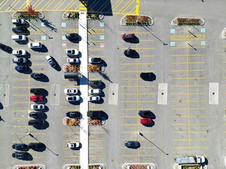 Aerial view of half empty parking lot in front of shopping center mall.