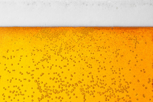 beer background texture with bubbles and foam