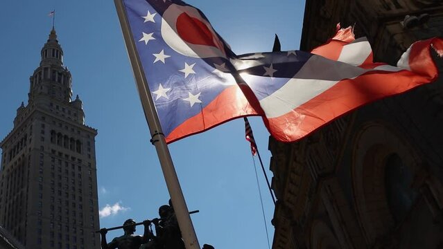 Ohio flag waving in slow motion with sun flares