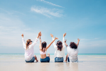 Group of girls sitting on the beach, Beach summer holiday sea people concept