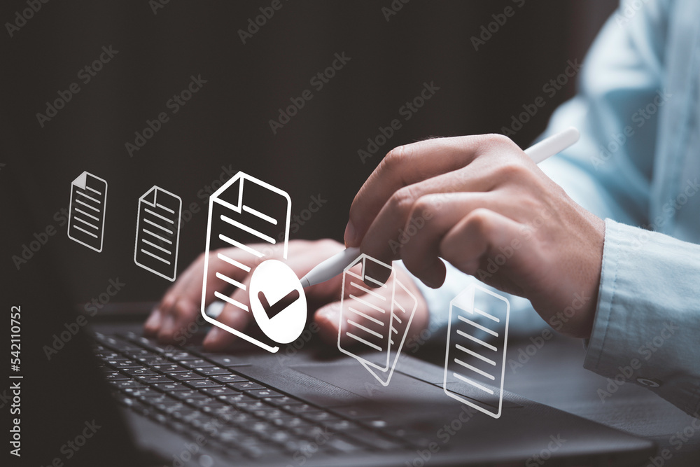 Poster Businessman using laptop computer and electronic pen with virtual document and correct mark sign for online paperless  approve project document and quality assurance concept.