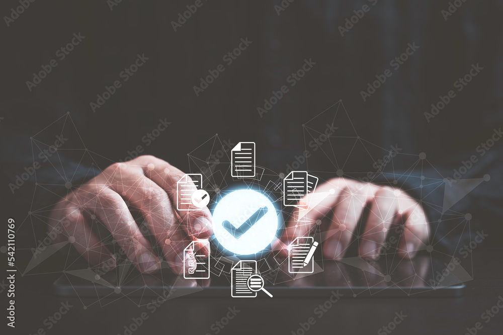Aufkleber Businessman using tablet with virtual document and correct mark sign for online approve project paperless and quality assurance concept.