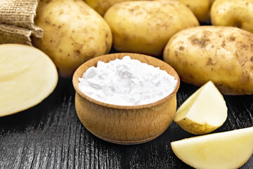 Starch potato in bowl on wooden board