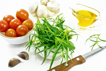 Tarragon in mortar on wooden table