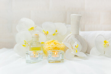 Thai Spa Treatments aroma therapy salt and nature green sugar scrub massage with orchid flower on wooden white with candle. Thailand. Healthy Concept