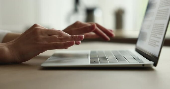 Close up female hands typing message on laptop sit at office desk, remote work on-line. Businesswoman corresponds to client, studying prepare essay or summary. Modern tech, workflow, software concept