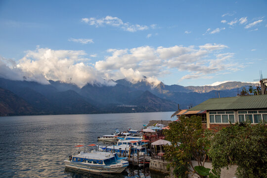 Boats docked on Lake Atitlan, Guatemala with surrounding mountains on January 5, 2016.