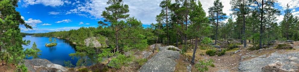 Fototapeta na wymiar Panoramic photo of a lake in the forest of the Swedish nature