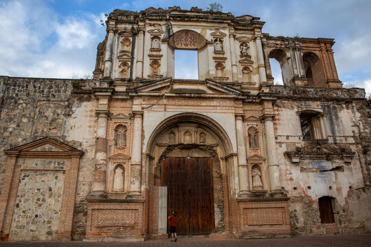 Man admires Temple and College of the Company of Jesus in Guatemala