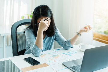 Portrait of sme business owner, woman using computer and financial statements Anxious expression on expanding the market to increase the ability to invest in business