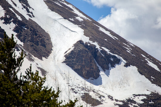 Snow On Steep Mountain Side