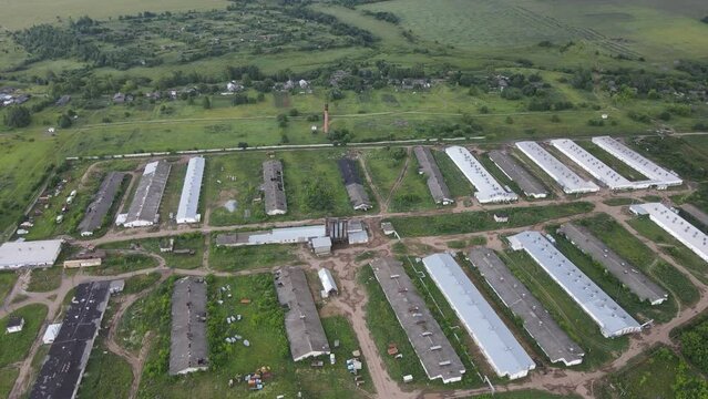 Agricultural barns of chicken farm located in vast rural valley