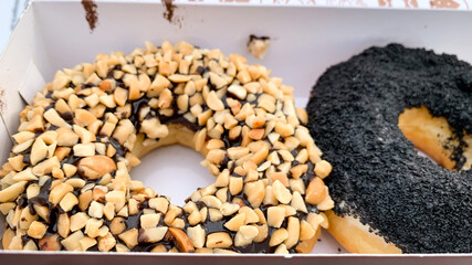donuts with cashew and chocolate toppings.