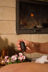 Masseur at work when giving massage to woman at home in room