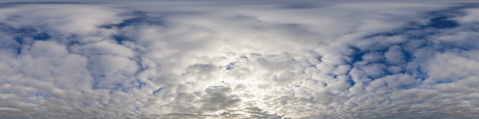 Dark blue sunset sky panorama with Cumulus clouds. Seamless hdr pano in spherical equirectangular format. Complete zenith for 3D visualization, game and sky replacement for aerial drone 360 panoramas.