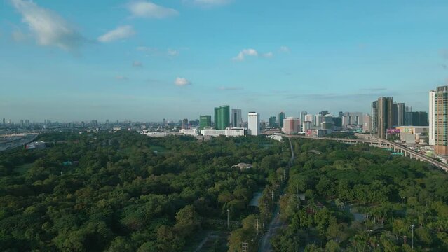Aerial view city public park with Chatuchak weekend market and city office building Bangkok Thailand