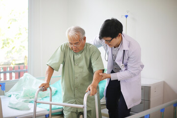 Caring nurse talking with old patient in living room at homecare visit. Medicine caregiving concept