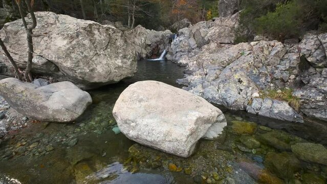L'Agnone river cascades over rocks into natural pools in the forest of Vizzavona alongside the GR20 trail in Corsica
