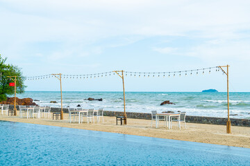 dinning table and chair on beach with sea background