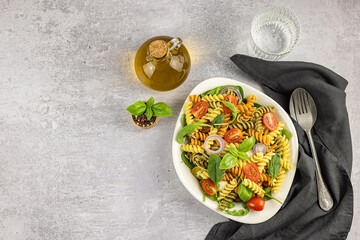 Pasta or noodle salad from wheat and lentils fusilli. Lunch or dinner meals are full of carbohydrates, protein, and dietary fiber. 