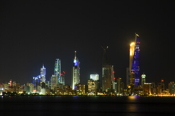 Night in Kuwait City Scape Landscape Panorama with a light in the Building.